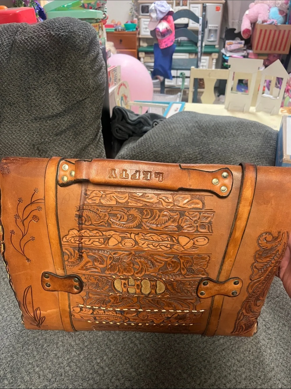 Hand-Tooled Tan Leather Briefcase with Embossed Motifs